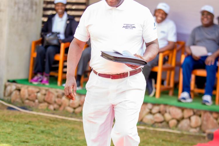 Red carpet things! The Honourable Chief Justice majestically walking to address the gathering