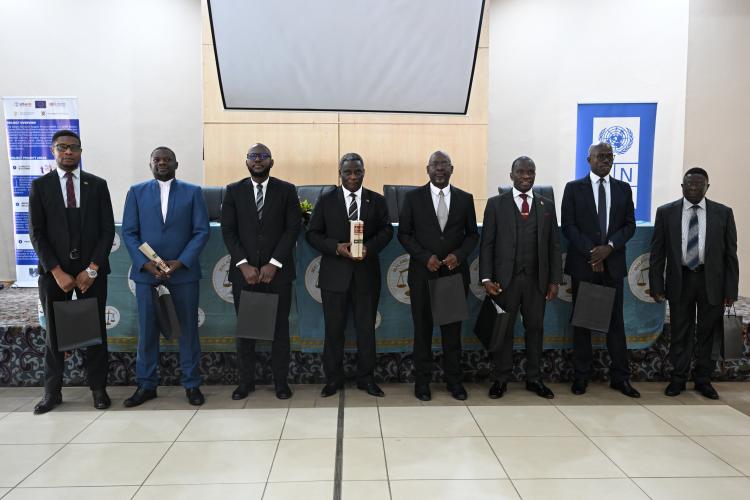 The Chief Justice poses with recipients of the Law Reports: Chimwemwe Chithope-Mwale, Director of Malawi Legal Aid Bureau; Robert Mkwezalamba, Board Member of Civil Society Elections Integrity Forum; McHarven Ngwata, Vice President of Malawi Law Society; Dr. Rowland Cole – Chief Technical Advisor, Rule of Law - UNDP; Thabo Chakaka Nyirenda, Attorney General; Hon. Deputy Chief Justice Lovemore Chikopa, on behalf of the Supreme Court; and Hon. Justice John Chirwa, on behalf of the High Court