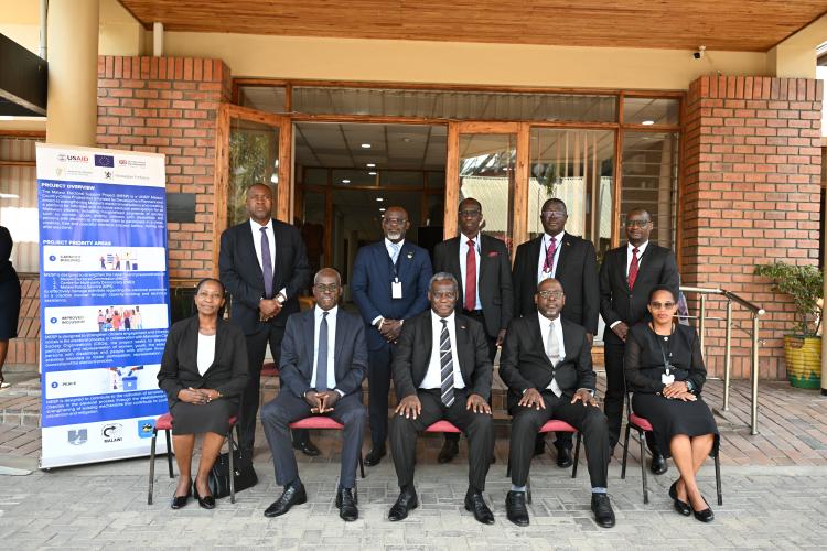 The Chief Justice poses with facilitators alongside the Deputy Chief Justice, UNDP representative and Chairpersons of the Judiciary Training Committee and Judiciary Committee on Elections.